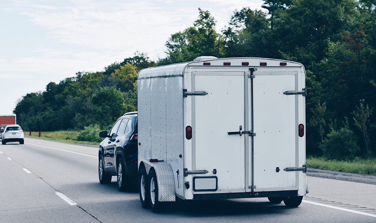 Car towing a caravan / horse box / something similar